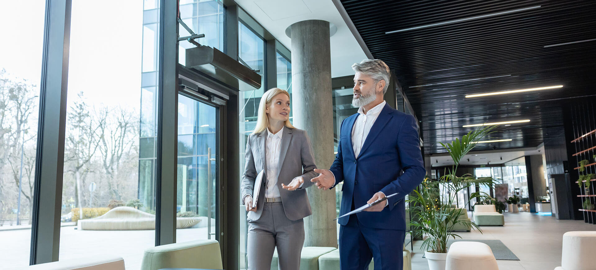 Two professionals walking in hotel lobby